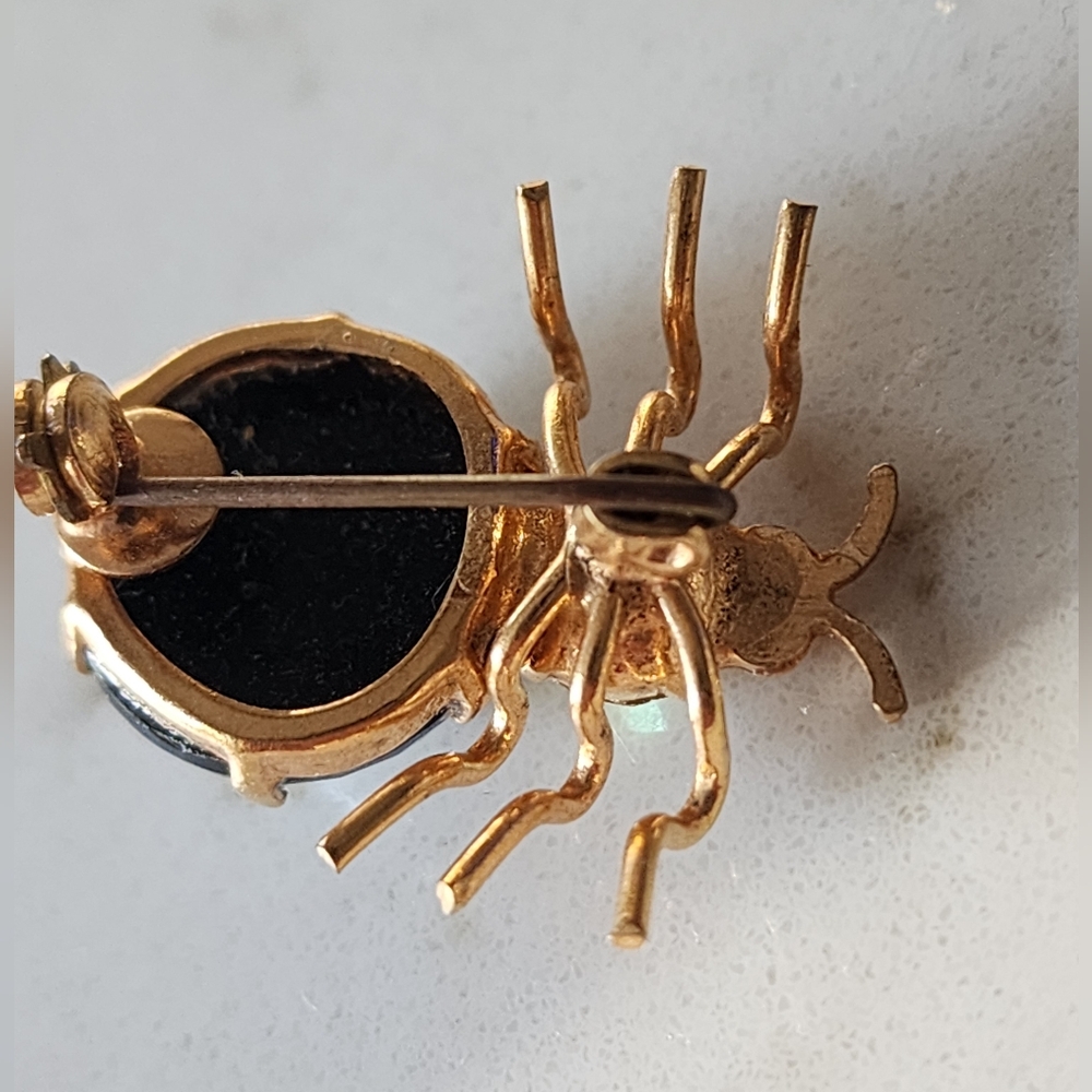 Whimsical Gold and Black Spider Brooch with Dynamic Design - Picture 4 of 6